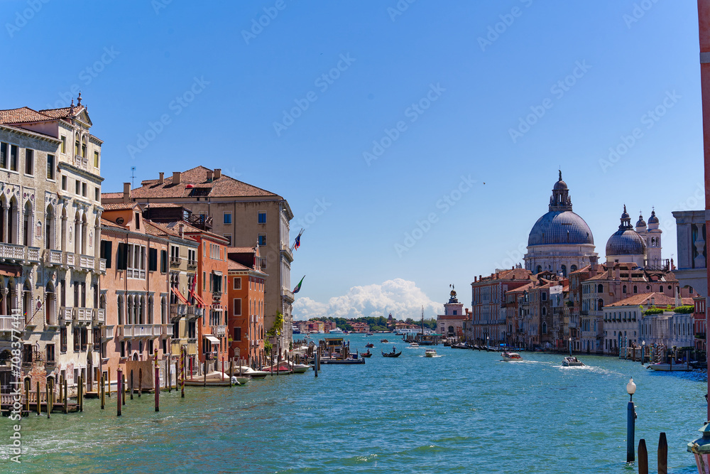 Scenic view over Grand Canal at the old town of Venice seen from Accademia Bridge on a sunny summer day. Photo taken August 7th, 2023, Venice, Italy.