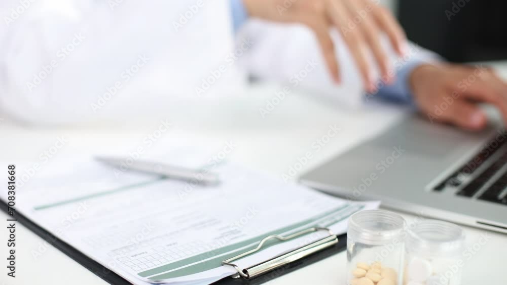 Stethoscope, red heart and cardiogram on gray table. Cardiology concept