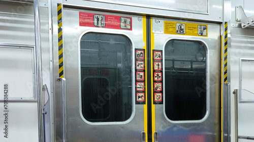 Indonesian Train Doors Adorned with Cultural Motifs and Unique Symbols photo