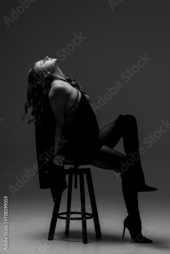 one caucasian woman exercising yoga in silhouette studio isolated on white background