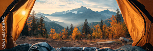 POV view, resting traveler in the camping tent, view to the mountain canyon, scenic autumn nature background, adventure concept photo