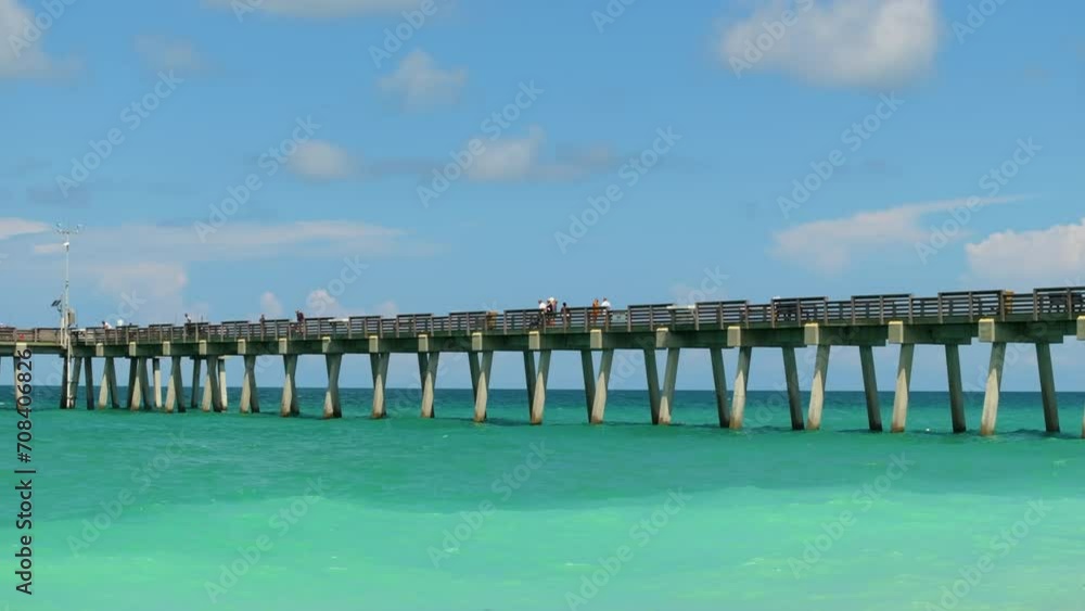 People enjoying vacation time on Venice fishing pier in Florida. Seaside summer activities on fresh air People enjoying vacation time on Venice fishing pier in Florida. Seaside summer activities on fresh air