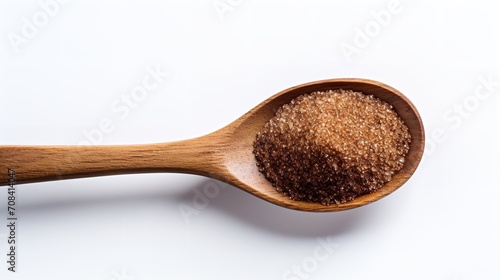 Brown sugar on a wooden spoon, seen from above, Generative AI.
