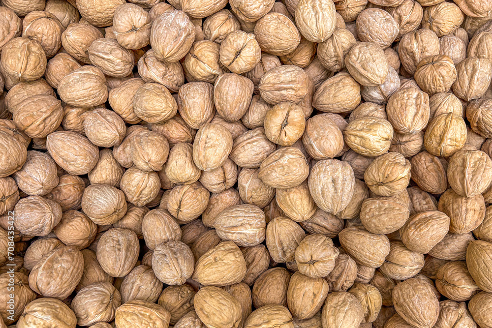 Walnuts background. Texture of walnuts in top view Walnuts background. Texture of walnuts in top view