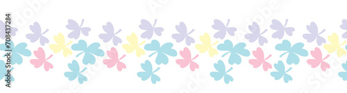 A decorative border of blue and pink clover leaves is highlighted on a white background. The pattern is vector. For nature and design. Hand-drawn plants, a frame for a postcard.