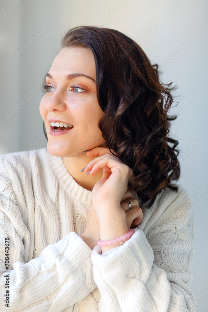 Close portrait of young happy pleased brunette girl with closed eyes touching clean fresh skin. Close portrait of young happy pleased brunette girl with closed eyes touching clean fresh skin.