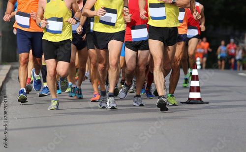 running race with feet and legs of many runners sports athletes © ChiccoDodiFC