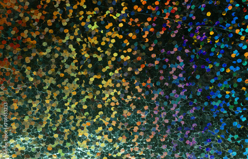 macro photo of dark rainbow holographic dot foil material, colorful hologram surface, glitter pixel pattern background.