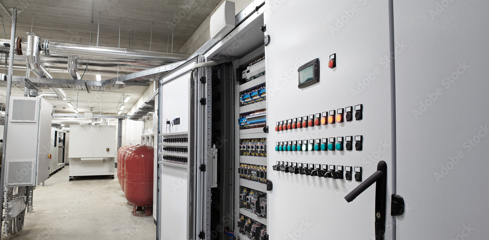 Electrical panel cabinet for HVAC system control, managing heating, ventilation, air conditioning, and cooling. Climate control system, including the boiler room, ensures comfort of the rooms building - obrazy, fototapety, plakaty 