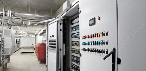 Electrical panel cabinet for HVAC system control, managing heating, ventilation, air conditioning, and cooling. Climate control system, including the boiler room, ensures comfort of the rooms building photo