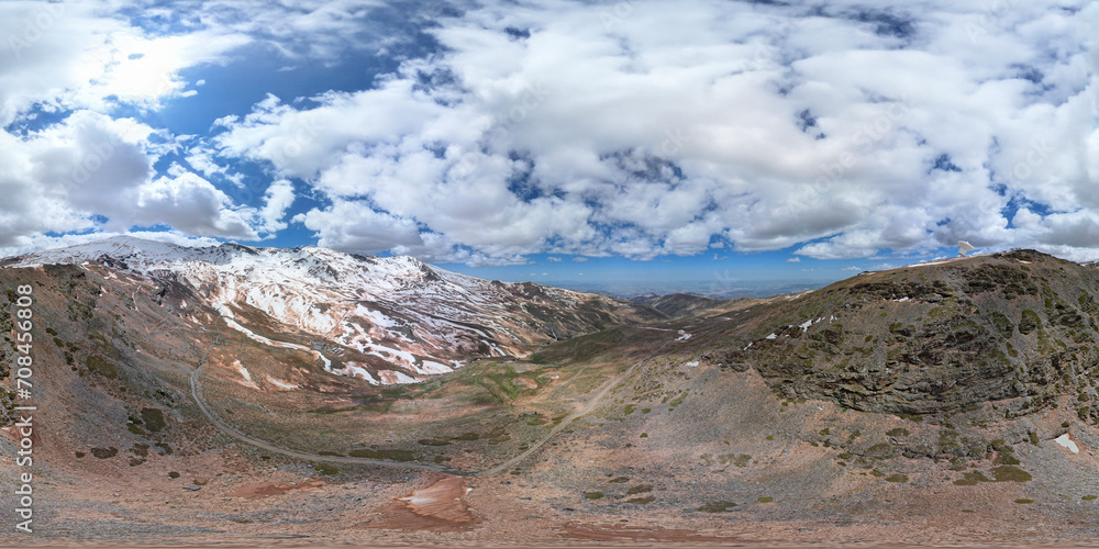 360 degree VR image. Radio telescope on the summit of snowy mountains. Aerial view of telescope and snowy peaks. Andalusia. Spain.