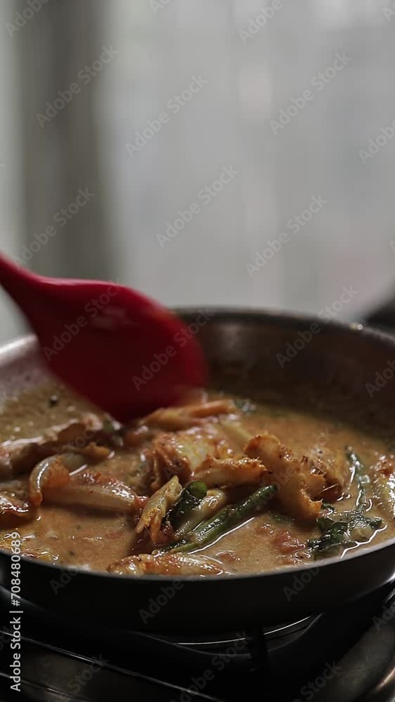 A close-up video of preparing spicy Indian homemade fish curry at home A close-up video of preparing spicy Indian homemade fish curry at home