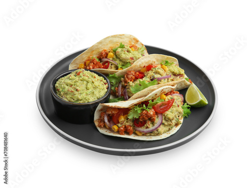 Delicious tacos with guacamole, meat, vegetables and slice of lime isolated on white