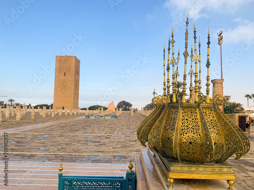 Rabat, Morocco, 04-05-2023: panoramic view of Hassan Tower, minaret of an incomplete mosque commissioned by the third Caliph of the Almohad Caliphate, and Mausoleum of Mohammed V and his two sons photo
