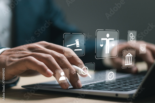 Legal advice business concept. Businessman use laptop with virtual law icon for business legal advice, Labor law, Lawyer, Attorney at law. photo