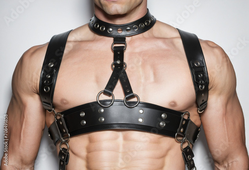 Close-up of man in black leather straps, digitally created photo