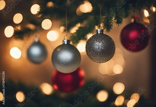 Several Christmas balls hanging on an out of focus background