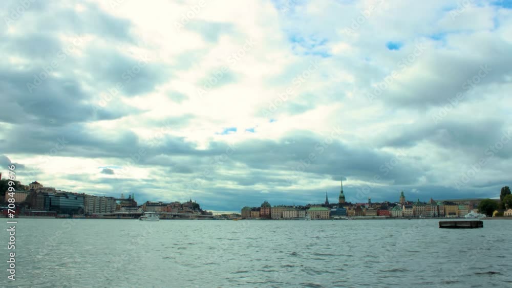 Timelapse of Stockholm Skyline from the harbour on a cloudy day with ships Timelapse of Stockholm Skyline from the harbour on a cloudy day with ships