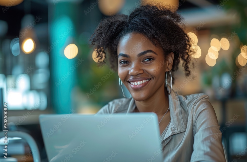 Happy american woman working on laptop in office, accountability picture Happy american woman working on laptop in office, accountability picture