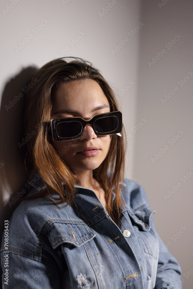 Young woman wearing unconventional sunglasses Young woman wearing unconventional sunglasses
