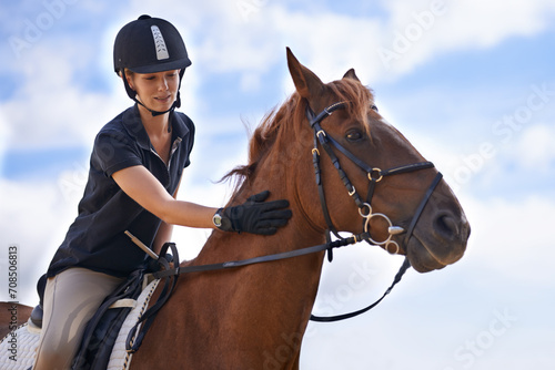 Love, horse riding or equestrian in countryside or outdoor with rider or jockey for recreation or adventure. Relax, sport or woman with healthy pet animal for training, exercise or wellness on farm © Tasneem H/peopleimages.com