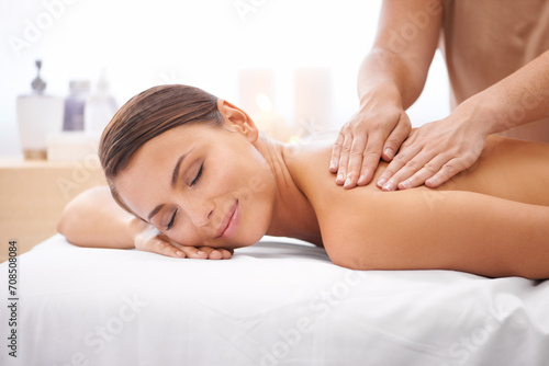 Woman, hands of masseuse and back massage at spa, aromatherapy and healing with wellness. Calm, natural and beauty with skincare, body care and health, holistic treatment for zen or stress relief photo