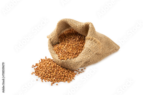 Raw buckwheat in burlap isolated on white background.Wheat grains, porridge, cereal, raw buckwheat in a plate. Healthy food. Porridge. Diet. Organic cerea. Space for text.Copy space.