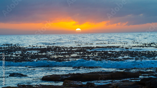 Beautiful sunset at Kommetjie Beach, Western Cape, South Africa photo