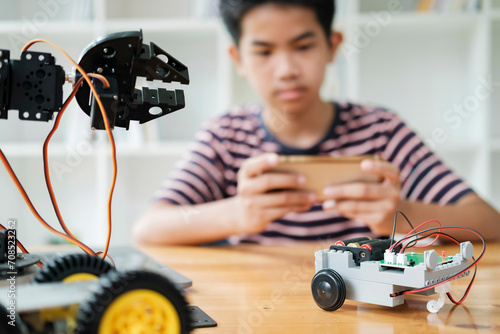 Wallpaper Mural Asian teenager doing robot project in science classroom. technology of robotics programing and STEM education concept. Torontodigital.ca