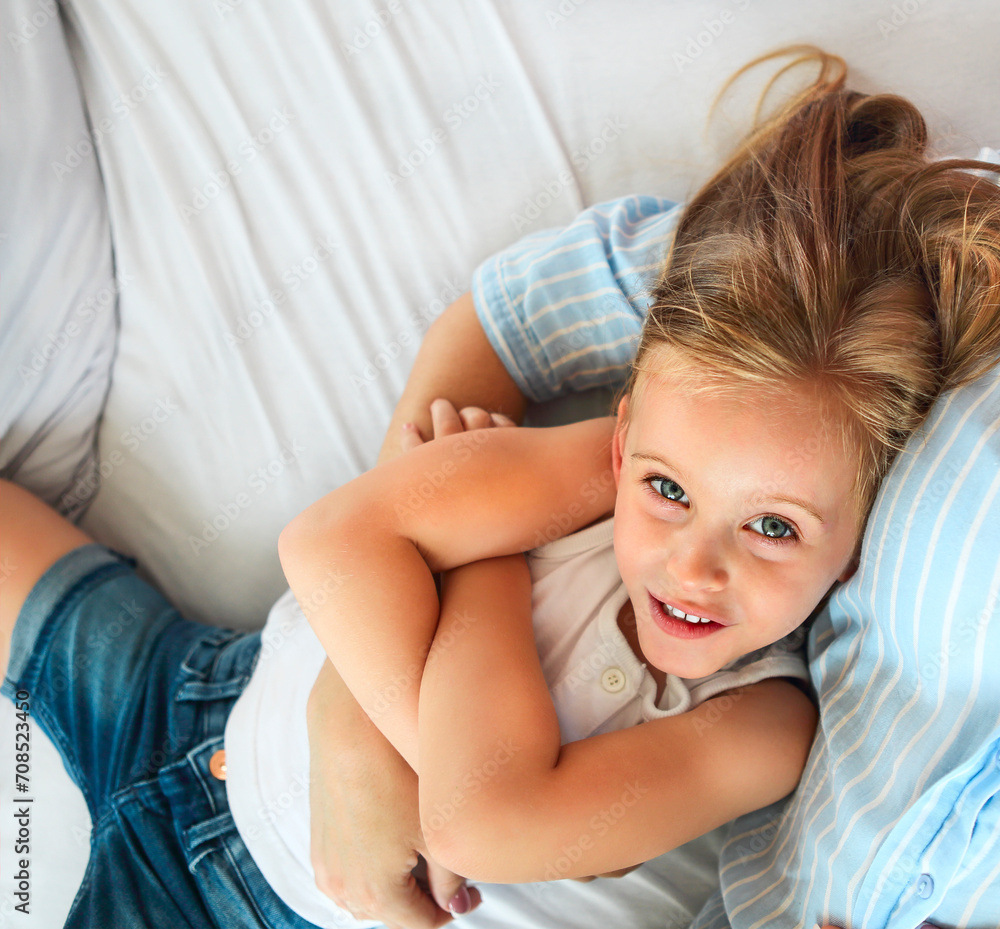 Cute loving emotional woman hugging her daughter tight while spending the morning in bed and feeling happy. Nose to nose Cute loving emotional woman hugging her daughter tight while spending the morning in bed and feeling happy. Nose to nose