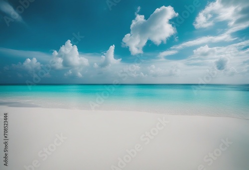 Beautiful sandy beach with white sand and rolling calm wave of turquoise ocean on Sunny day on backg