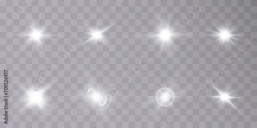 A set of light on a transparent background sparkles a shiny magic star. Glittering star, vector glowing star light effect.