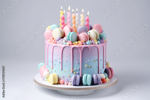 Delicious cake in multi-colored pastel colors with flower decorations on top