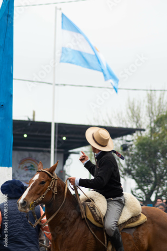 gaucho rider mounted on a horse with his typical clothing