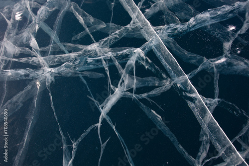 Bottomless ice of Lake Baikal in cracks.