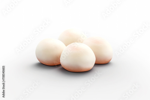 A set of four white mochi rice cakes. Round sweets on a white background. Created using generative AI.
