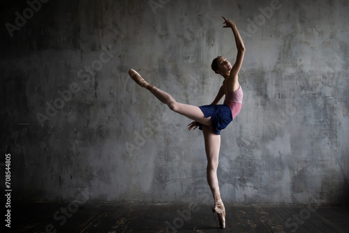 Fototapeta Naklejka Na Ścianę i Meble -  Dancing young ballerina.