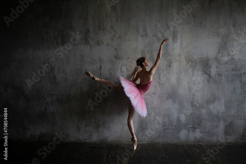 Ballerina in a tutu in a ballet pose.