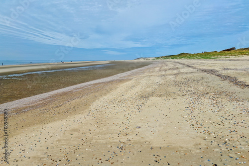 Almost deserted sandy beach; Burgh-Haamstede, Zeeland, Netherlands photo