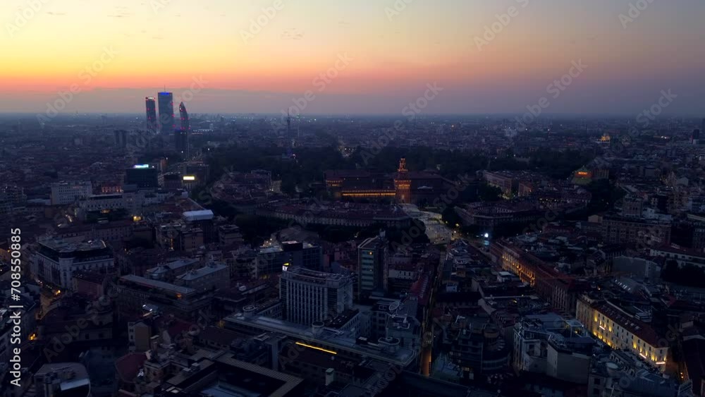 Aerial view of Milan city skyline at sunrise flies backwards. Theatrical performance is filmed from the Milan cityscape at sunset. Aerial photography. skyscrapers on the mountain zone of Milan. Italy Aerial view of Milan city skyline at sunrise flies backwards. Theatrical performance is filmed from the Milan cityscape at sunset. Aerial photography. skyscrapers on the mountain zone of Milan. Italy