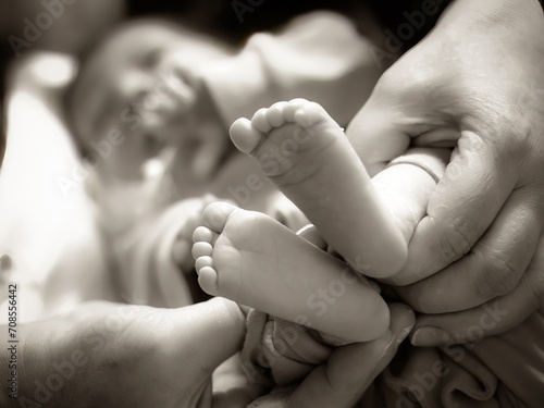 Close-up of Loving Parent Bonding with Newborn Child