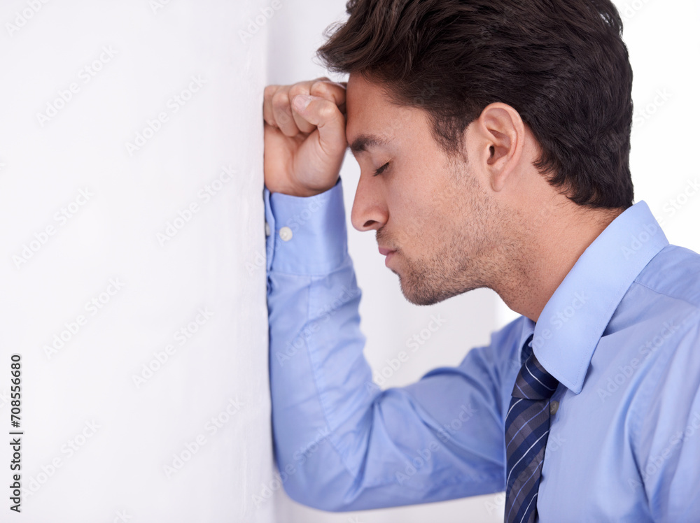 Stress, business man and head on wall for financial crisis, burnout and anxiety for challenge fail. Depression, frustrated and a tired professional in bankruptcy, debt and mistake in office mockup Stress, business man and head on wall for financial crisis, burnout and anxiety for challenge fail. Depression, frustrated and a tired professional in bankruptcy, debt and mistake in office mockup