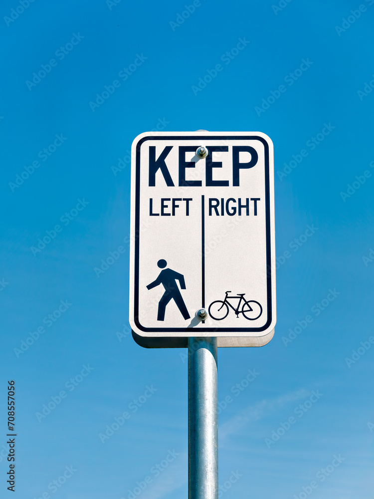 Bicycle and pedestrian shared route sign on clear sky background Bicycle and pedestrian shared route sign on clear sky background