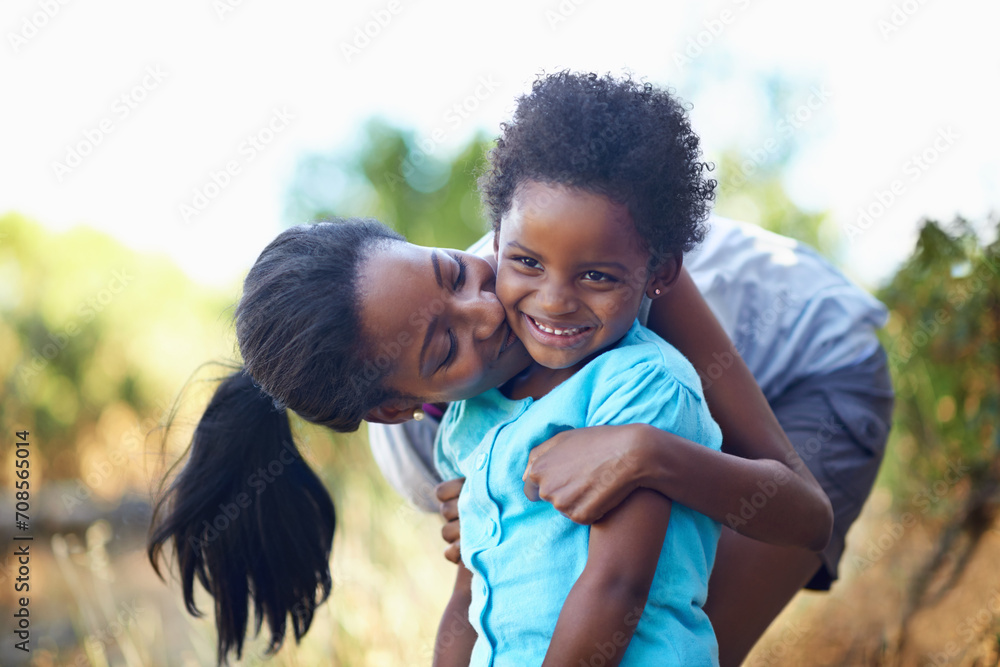 Child, kiss or mother hiking in forest to relax or bond on holiday vacation together in nature. Kid, African mom or happy black family in woods trekking on outdoor adventure with smile, love or hug Child, kiss or mother hiking in forest to relax or bond on holiday vacation together in nature. Kid, African mom or happy black family in woods trekking on outdoor adventure with smile, love or hug