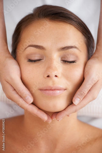Woman, spa or face massage from above for beauty, skincare treatment or dermatology at cosmetics salon. Calm client relax at wellness resort for reiki, facial acupressure or peaceful holistic therapy