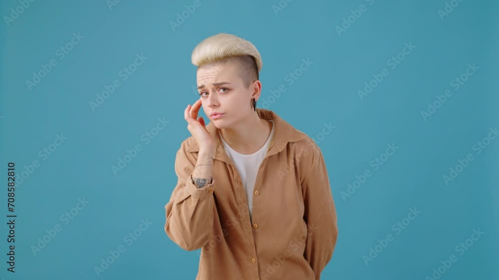 Insecure woman looking for flaws in appearance at mirror Insecure woman looking for flaws in appearance at mirror