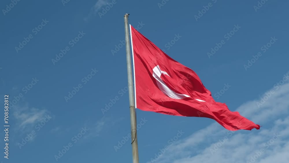 Turkish flag flies against the blue sky Turkish flag flies against the blue sky