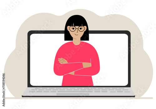 Woman communicates via videoconference through laptop screen. The concept of online meetings, webinars, remote work or work from home.