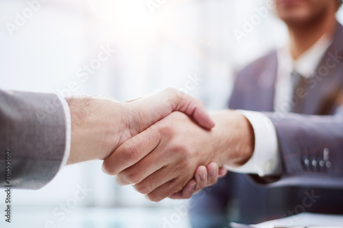 close up.businessman shaking hands with his business partner