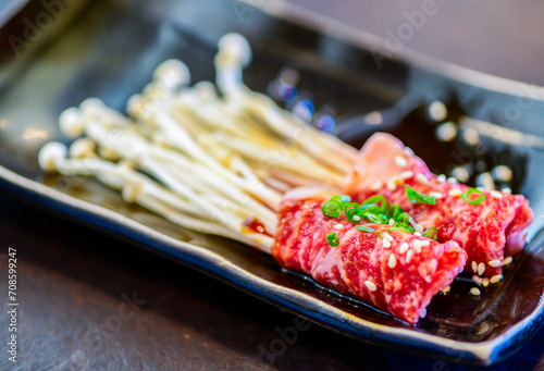 Enoki wagyu beef rolls on dish, Premium Japanese meat photo